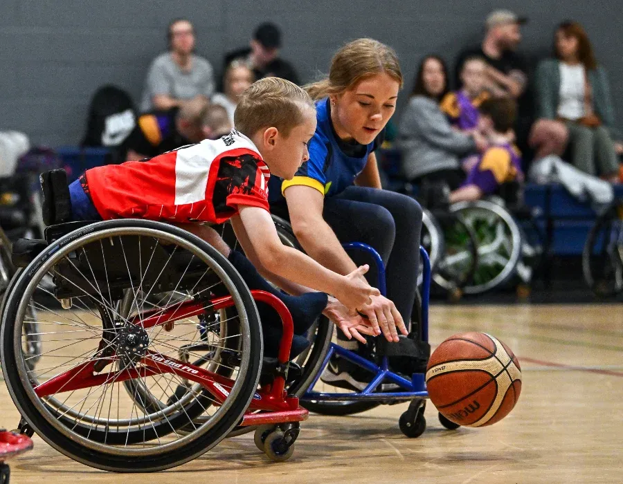 junior wheelchair basketball players in action