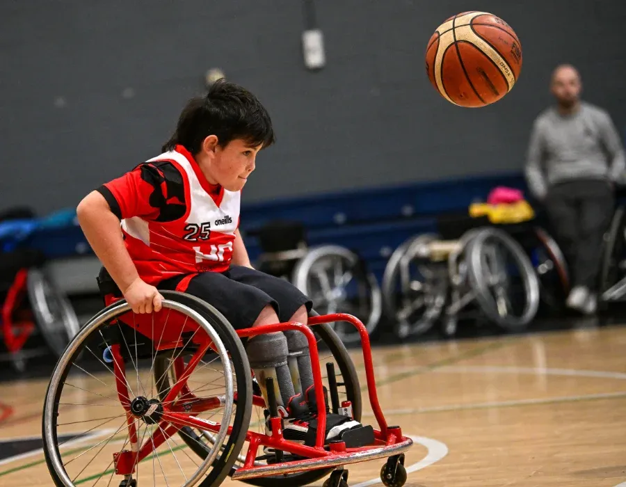 junior wheelchair basketball player in action